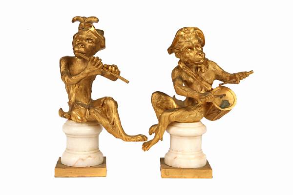 Appraisal: A pair of French gilt bronze monkey musicians circa on