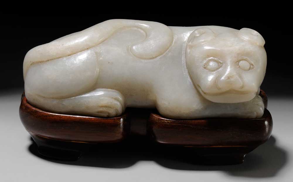 Appraisal: White Jade Tiger Chinese grayish white the recumbent beast with