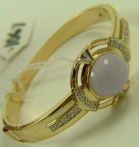 Appraisal: LAVENDER JADE AND DIAMOND BANGLE K yellow gold matches preceding