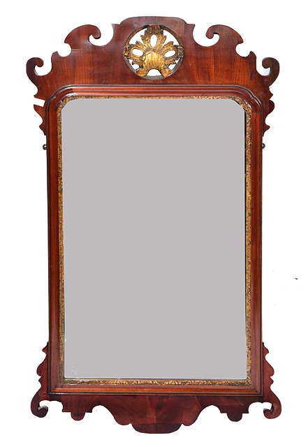 Appraisal: A GEORGE III MAHOGANY FRET FRAME HANGING WALL MIRROR with