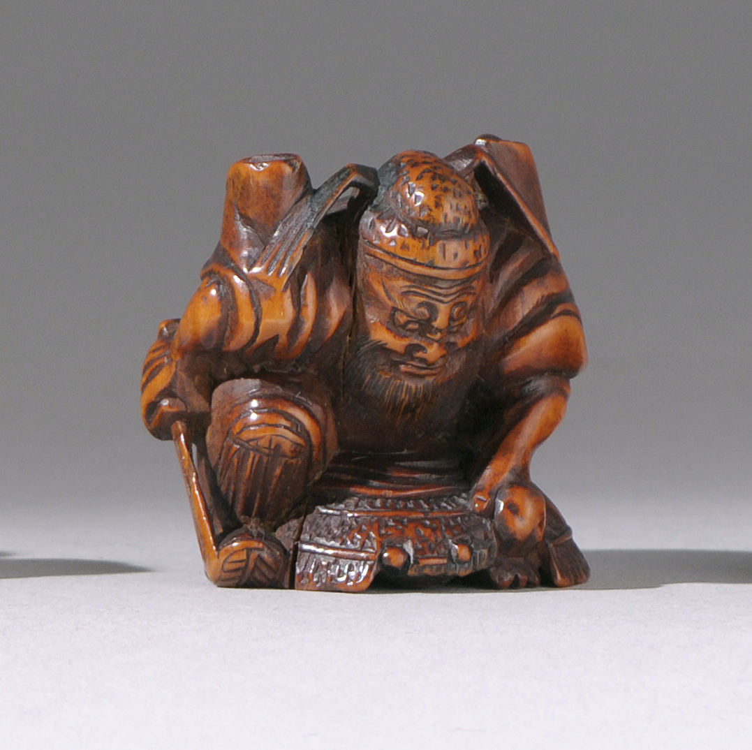 Appraisal: WOOD NETSUKE th CenturyIn the form of Shoki with an