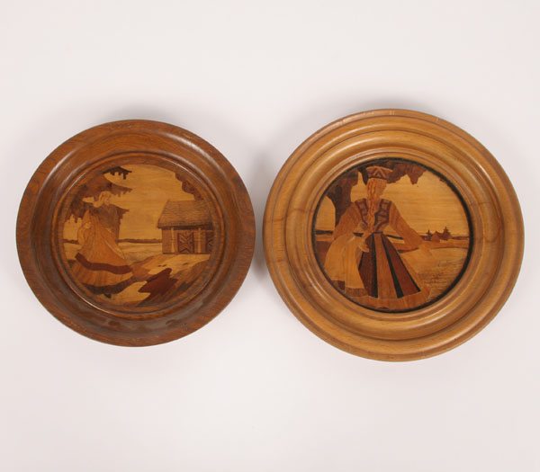 Appraisal: Pair inlaid decorative folk art scenes in turned wood dishes