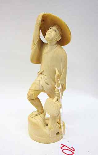 Appraisal: JAPANESE IVORY OKIMONO TRAVELER with hat and bag holding a