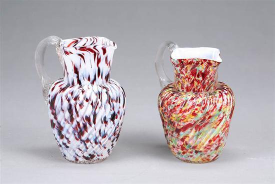 Appraisal: TWO GLASS PITCHERS Spatter pitchers with molded twist decoration and