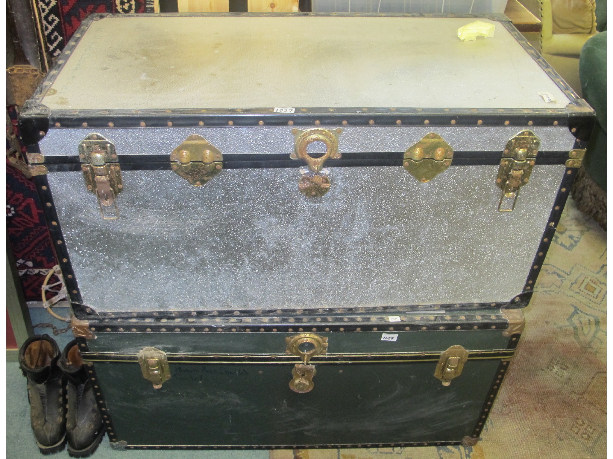 Appraisal: Two metal bound travel trunks