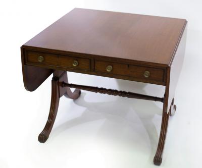 Appraisal: A Regency mahogany and rosewood crossbanded sofa table on end