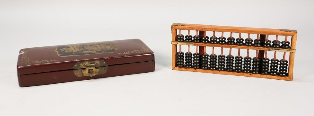 Appraisal: CHINESE ABACUS IN CASEChinese wooden abacus in wood and leather