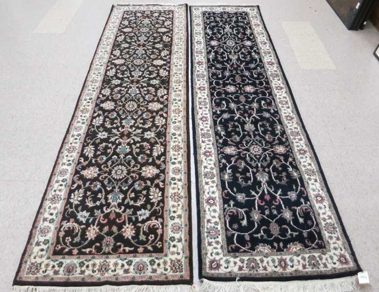 Appraisal: TWO SIMILAR HAND KNOTTED ORIENTAL RUNNERS Indo-Persians overall floral design