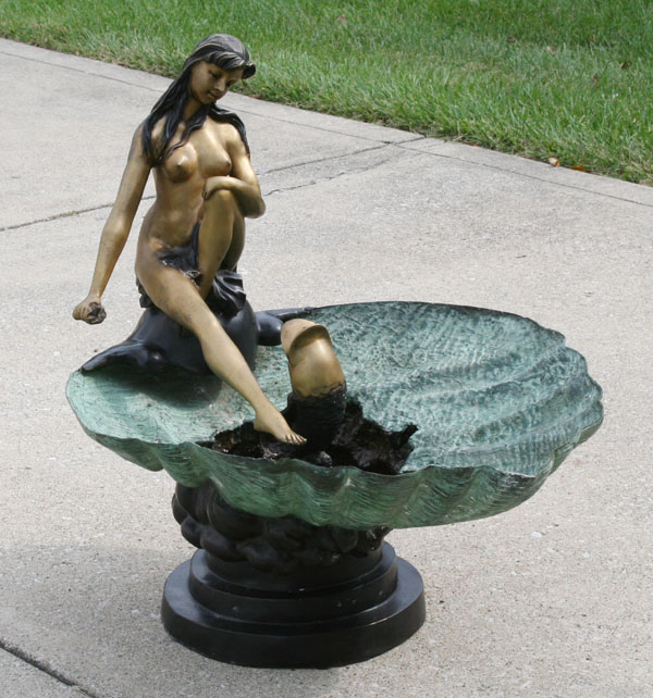 Appraisal: Decorative patinated bronze garden fountain with a female nude posed