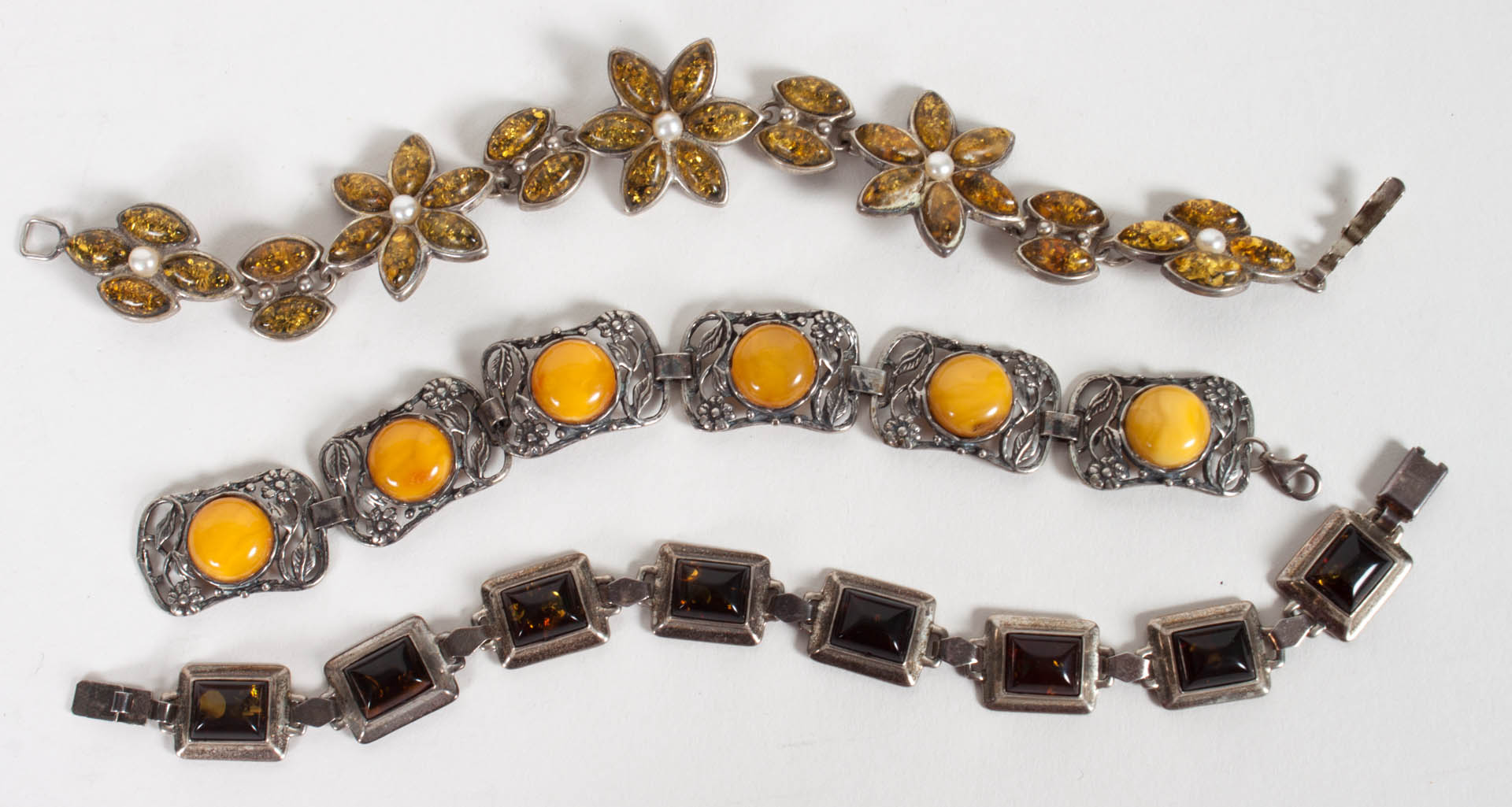 Appraisal: Three silver and amber bracelets the longest - in L