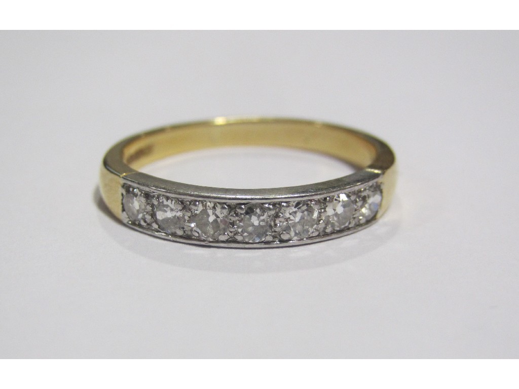 Appraisal: Eighteen carat gold diamond seven stone half hoop ring with