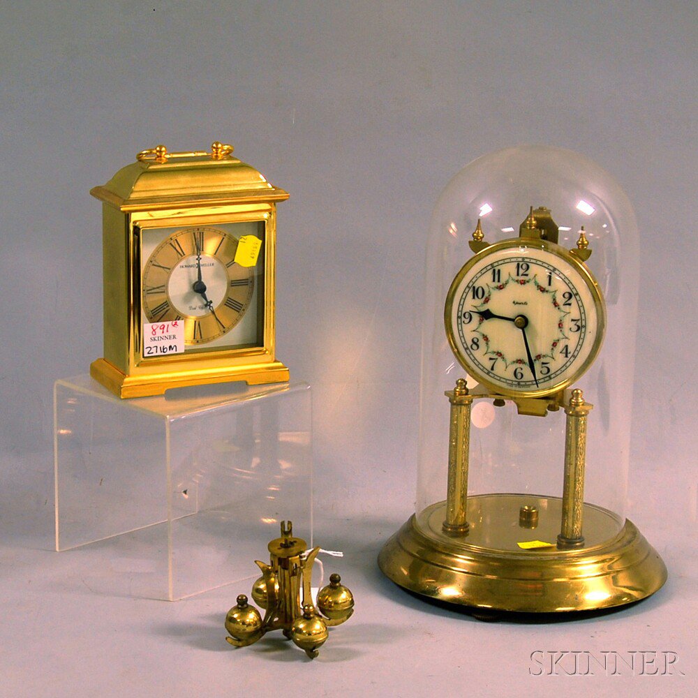 Appraisal: Two Brass Shelf Clocks a -day clock with an enameled