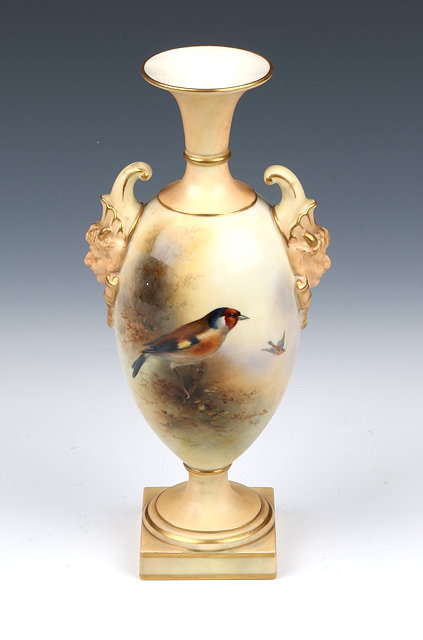 Appraisal: A ROYAL WORCESTER VASE of urn form with mask head