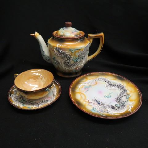 Appraisal: Oriental Porcelain Tea Set floral on black field floral tops