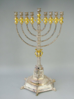 Appraisal: A parcel gilt and white metal Menorah st century the