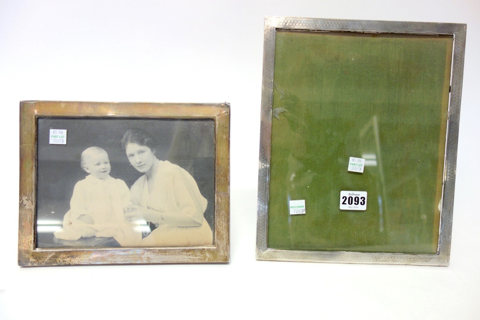 Appraisal: A silver mounted oak rectangular photograph frame with engine turned