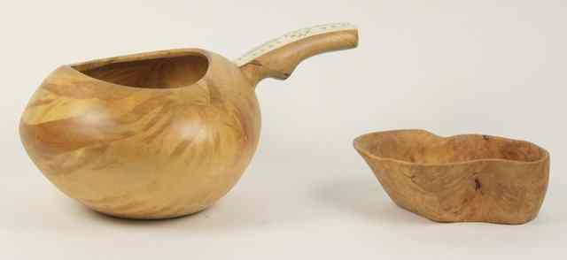 Appraisal: A turned wood pot the handle with bone covering signed