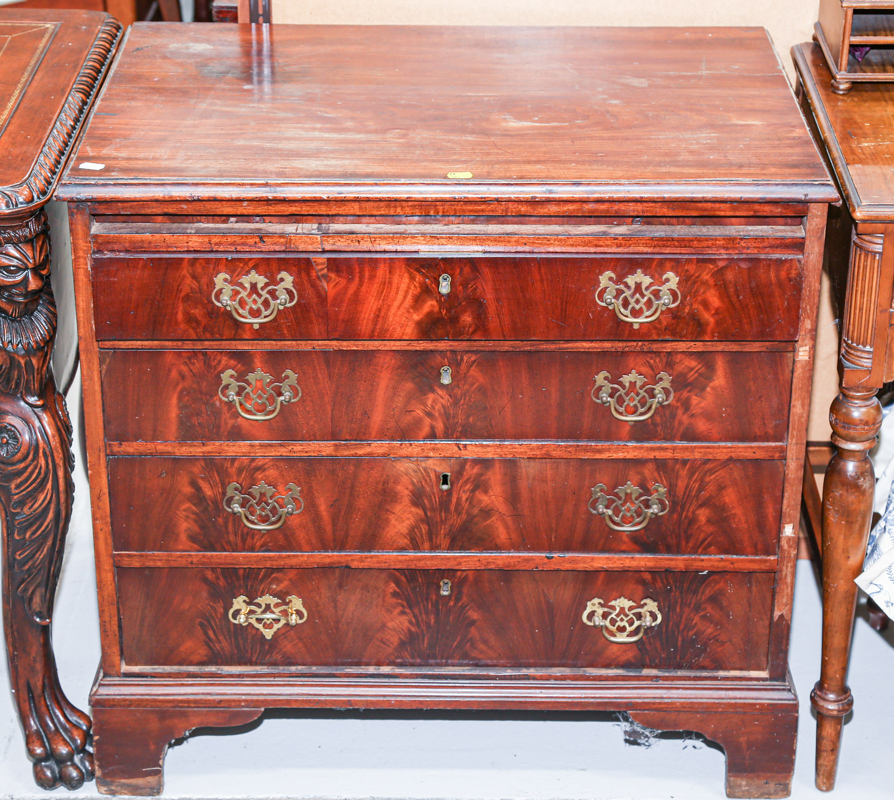 Appraisal: GEORGIAN MAHOGANY BACHELOR'S CHEST English Late th century with crotch-veneered