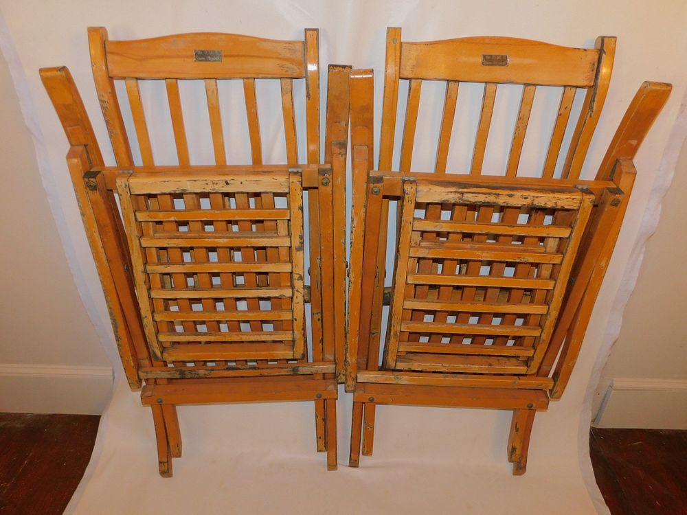 Appraisal: DECK CHAIRS FROM QUEEN ELIZABETH SHIP Pair of wooden foldking