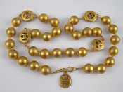 Appraisal: Chanel A gilt bead necklace by Chanel beads approx mm