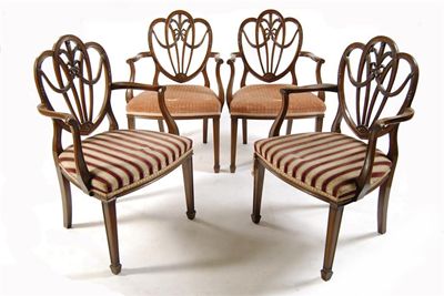 Appraisal: A set of four carved mahogany open armchairs in Hepplewhite