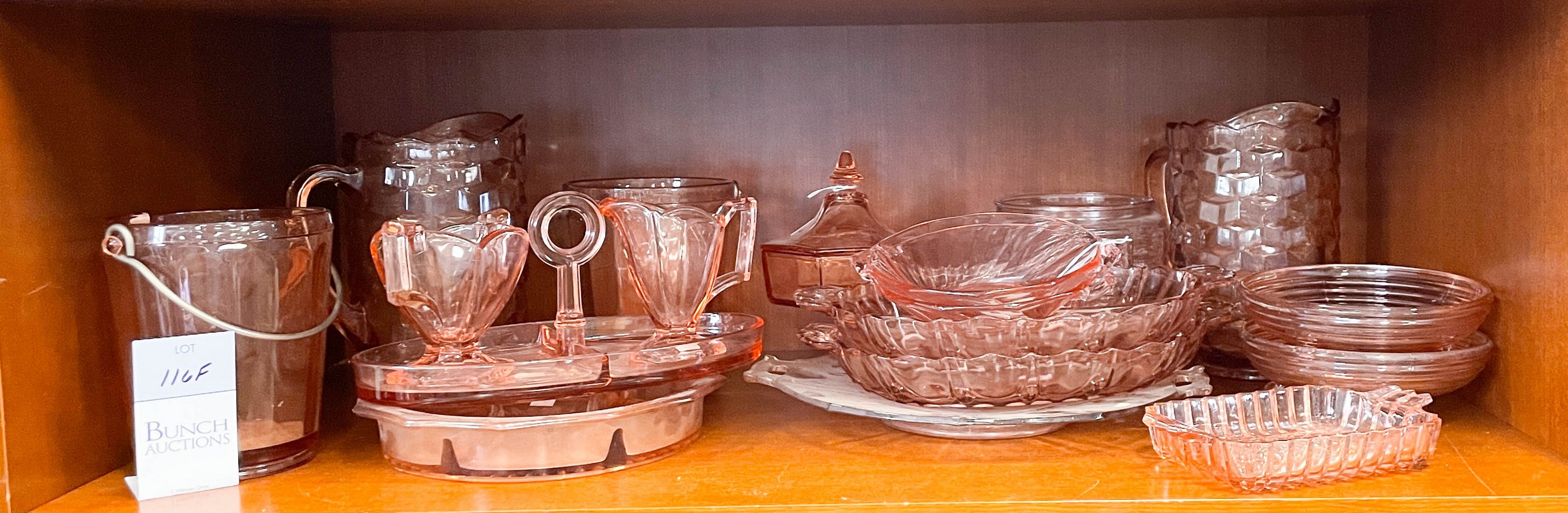 Appraisal: Pink glass serving pieces including American pattern pitchers ice buckets