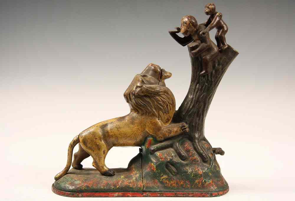 Appraisal: MECHANICAL CAST IRON BANK - Lion and Monkeys Cast Iron