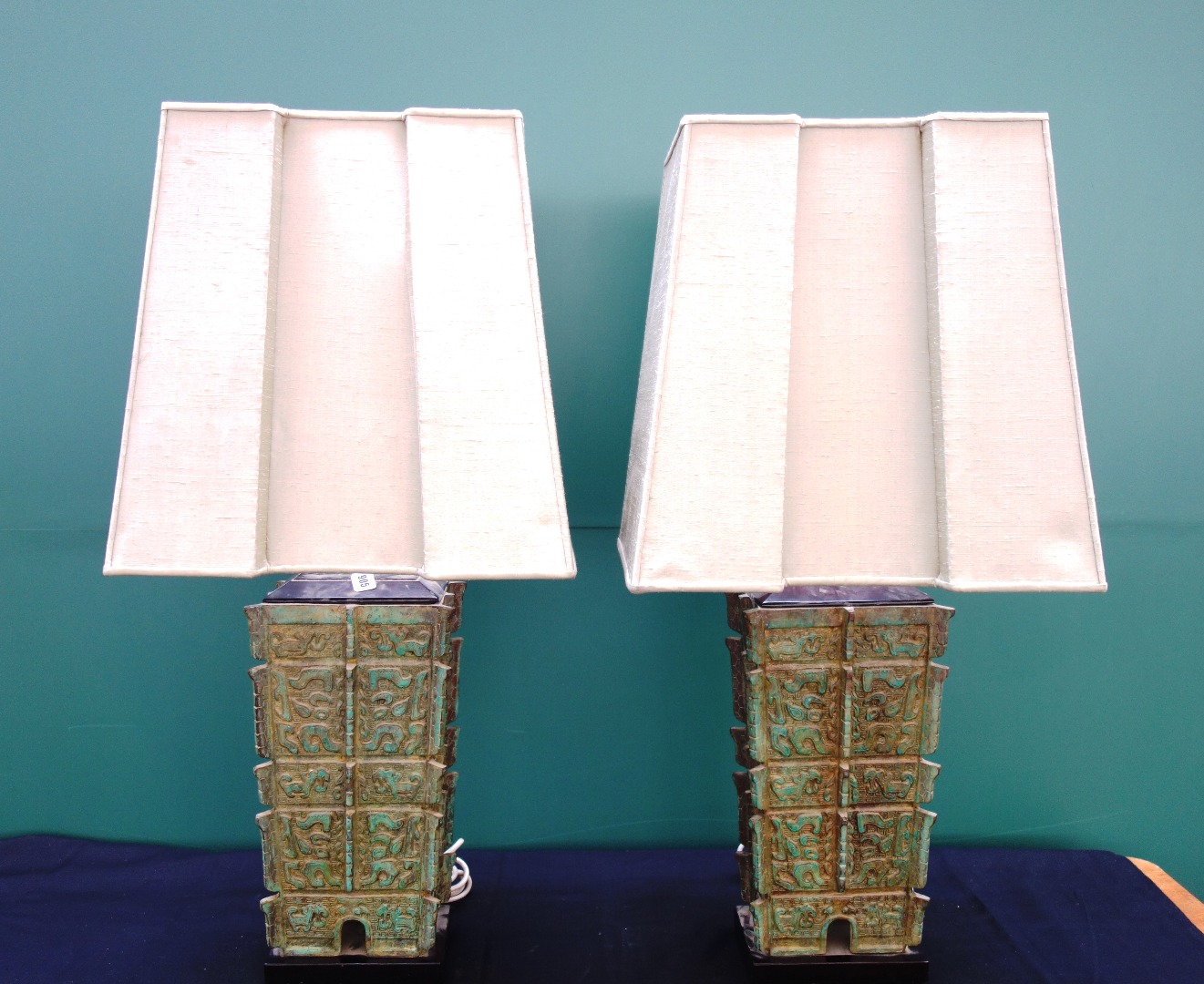 Appraisal: A pair of modern patinated table lamps of archaic Chinese