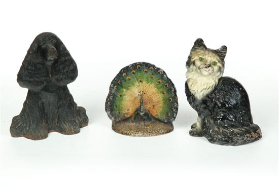 Appraisal: THREE CAST-IRON DOOR STOPS American st half- th century Seated