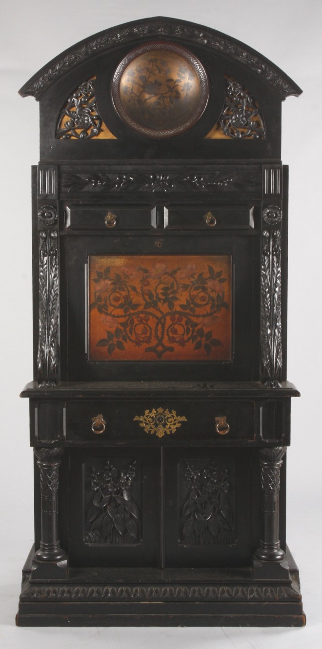 Appraisal: Ebonized walnut case bold carved crest with reticulated carving surrounding