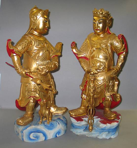 Appraisal: A group of five gilt and polychromed wood deities Including