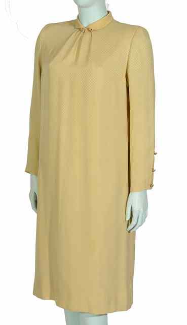 Appraisal: A 'CHANEL CREATIONS' LOOSE FITTING PALE YELLOW SILK DRESS TUNIC