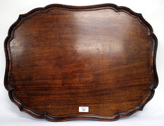 Appraisal: A TH CENTURY MAHOGANY CHIPPENDALE STYLE TRAY with shaped piecrust