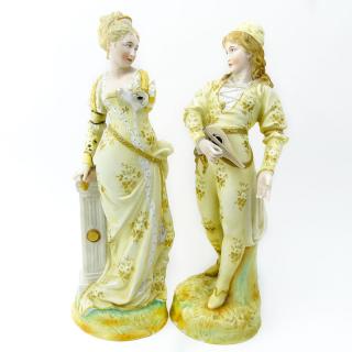 Appraisal: Two Porcelain Figurines Man Woman in costume Unsigned as is