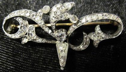 Appraisal: Silver topped yellow gold diamond pinScrolling floral design set with