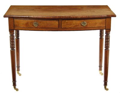 Appraisal: A th century mahogany bowfront side table with two frieze