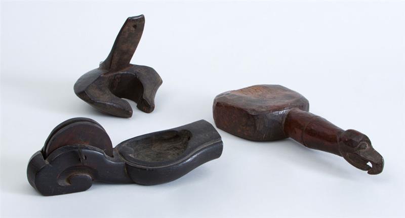 Appraisal: GROUP OF THREE CARVED WOOD OBJECTS Including a bird-headed pounder