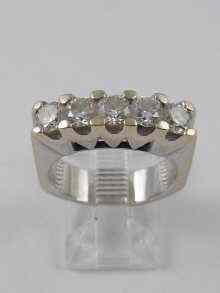 Appraisal: A five stone diamond ring set in white metal tests