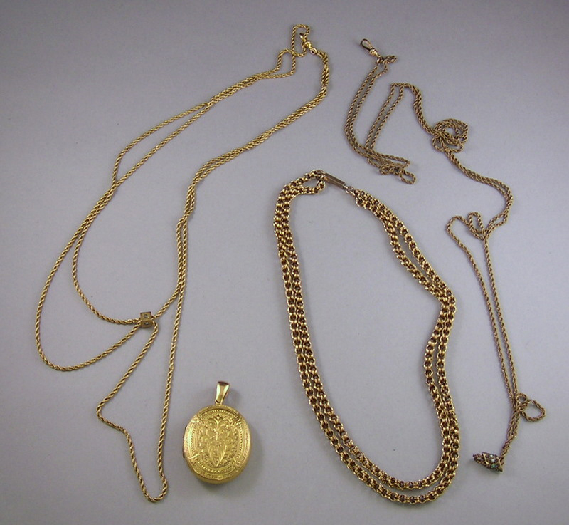 Appraisal: kt Gold Pendant with Two kt Gold Chains and an