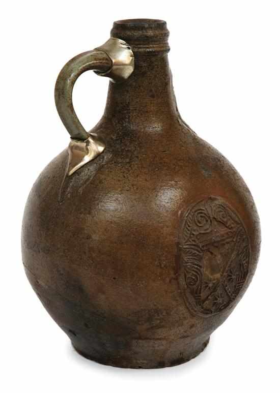 Appraisal: A German stoneware bellarmine jug th Century The bulbous base