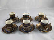 Appraisal: A set of six late Victorian gilt blue porcelain coffee