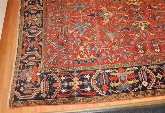 Appraisal: HERIZ old Red central field patterned with stylised plant motifs