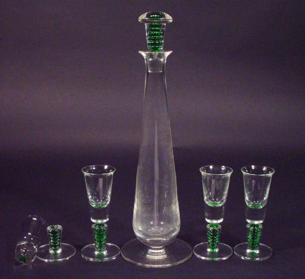 Appraisal: s Art glass decanter and four glasses with green stemmed