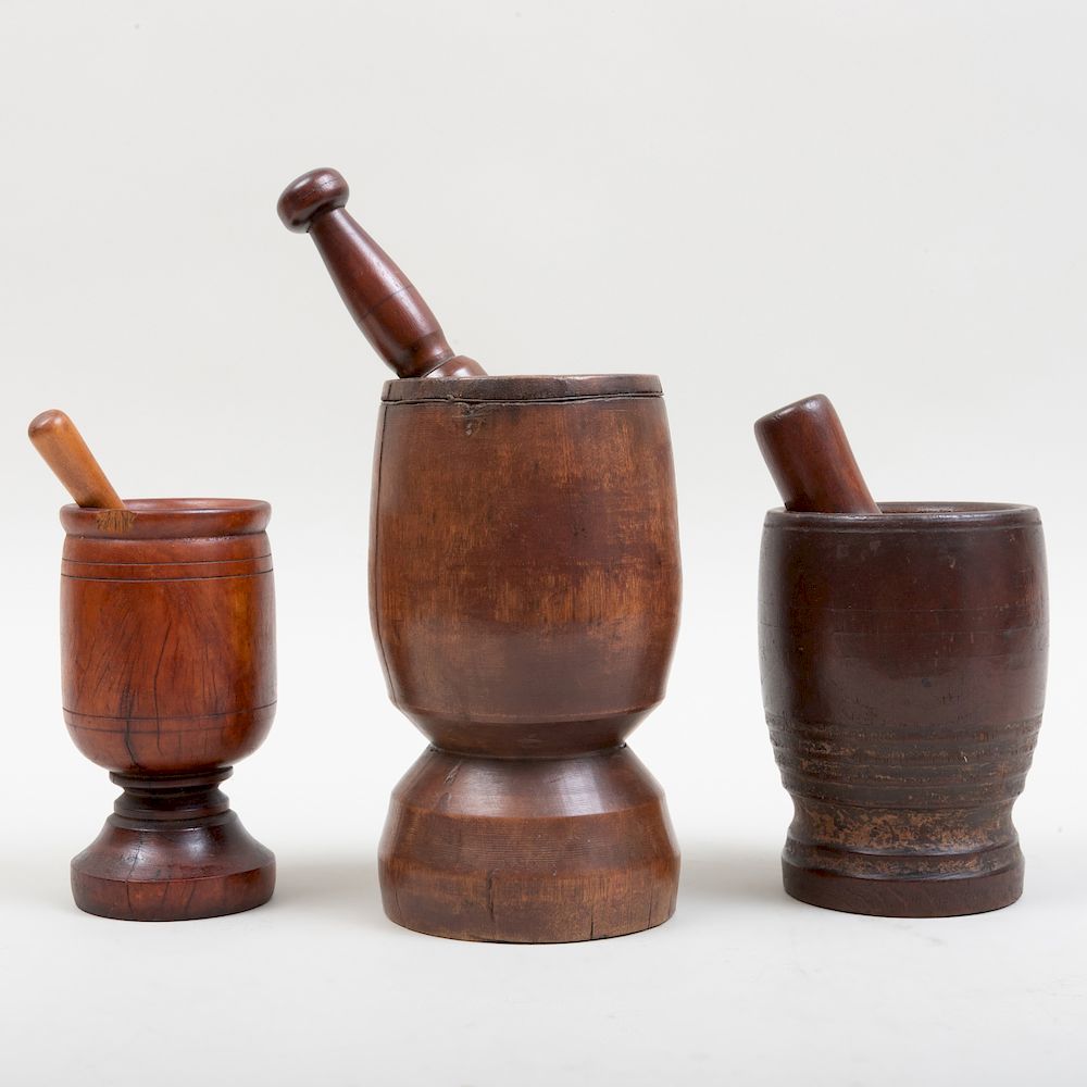 Appraisal: Three Carved Wood Mortars and Three Pestles The largest mortar