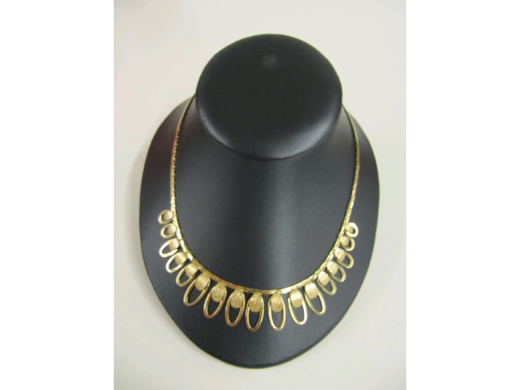 Appraisal: Nine carat gold necklace the front with a fringe of