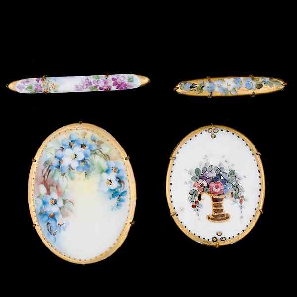 Appraisal: Painted porcelain brooches and pin A grouping of two painted