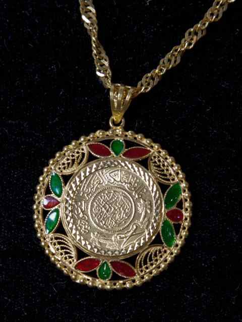 Appraisal: GOLD NECKLACE WITH RED AND GREEN JEWEL INSETS