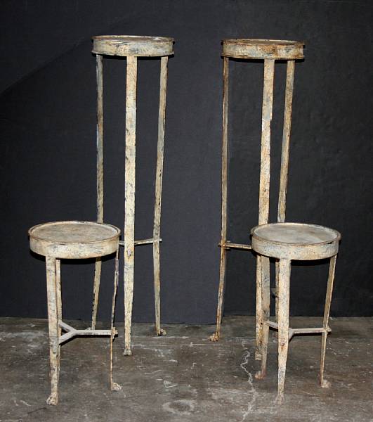 Appraisal: A pair of Pompeiian style painted metal urn stands and