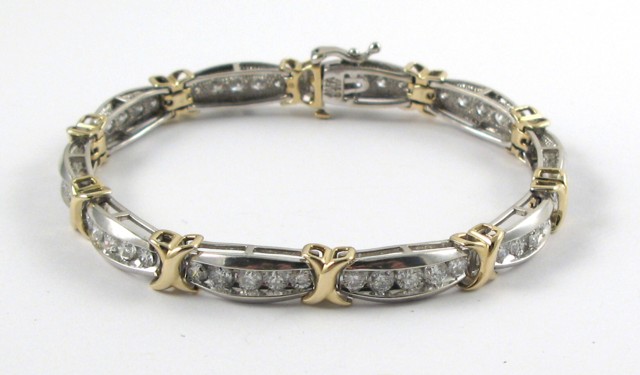 Appraisal: DIAMOND AND TEN KARAT GOLD TENNIS BRACELET - in length