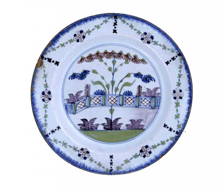 Appraisal: AN ENGLISH DELFTWARE PLATE LONDON paintged in blue red green